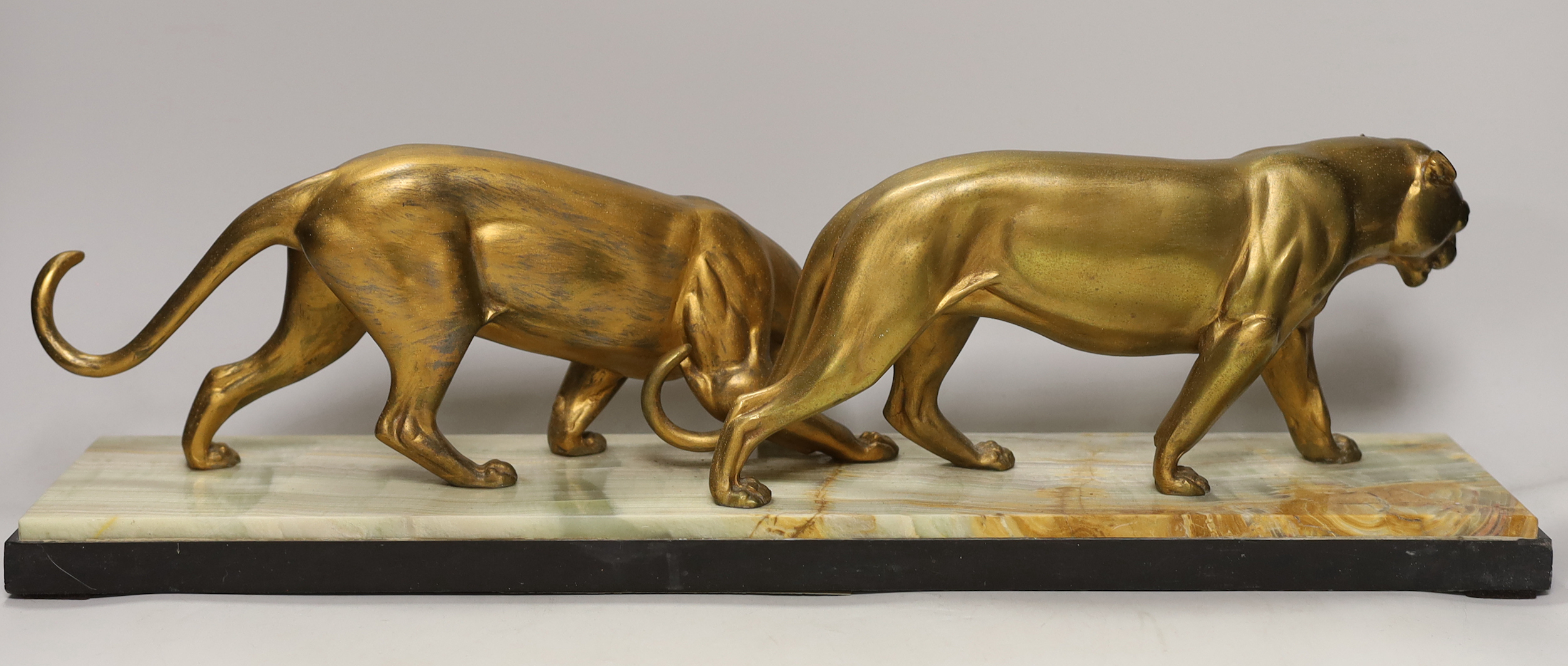 A French gilt metal ‘panther’ model group on a marble base, 56.5cm